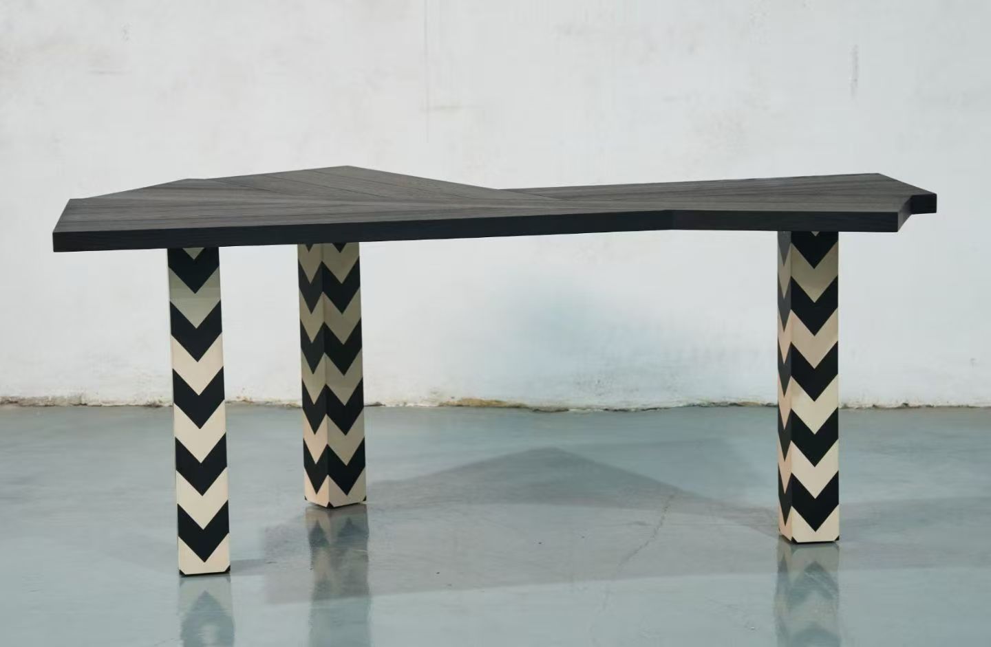 Chevron-leg dining table shown as a product and in a styled interior