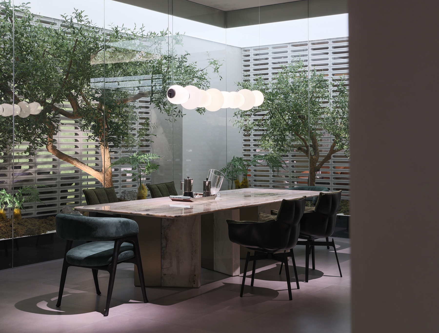 Chenxing dining area with marble table and courtyard light